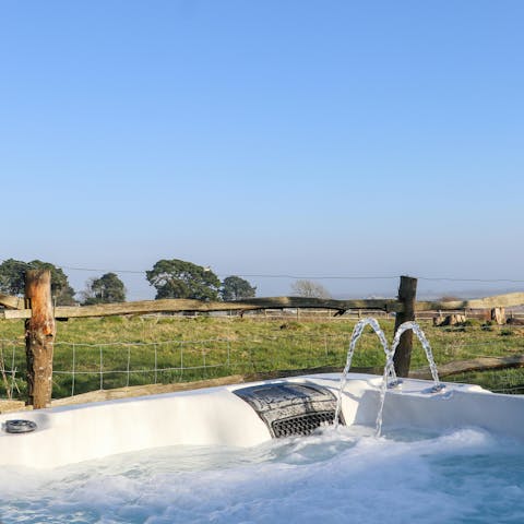 End the day with a dip in the hot tub (views included)