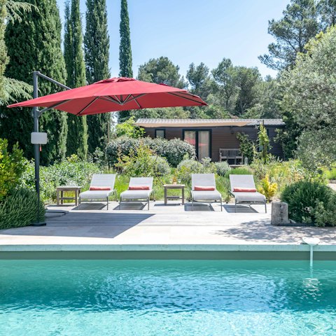 Sprawl out by the pool, rosé in hand