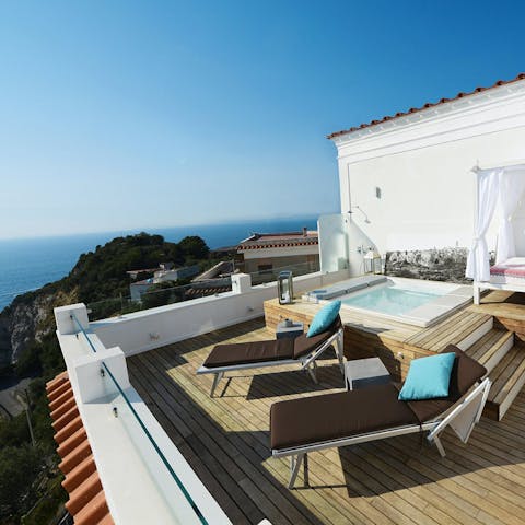 Laze on sun loungers before a refreshing dip in the jacuzzi