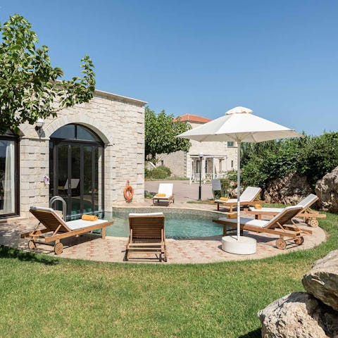 Relax by the plunge pool while planning a boat trip to Agii Theodori island