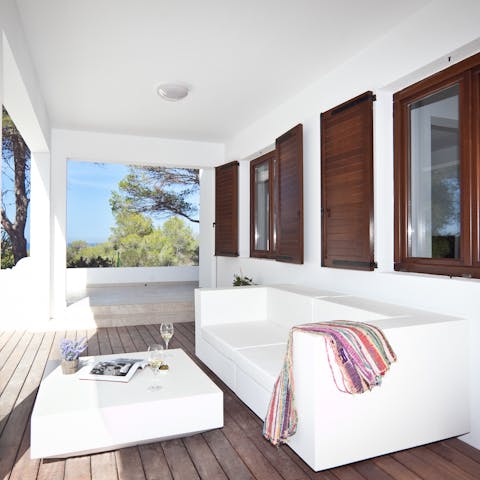 Curl up on the outdoor sofa with a good book and glass of wine