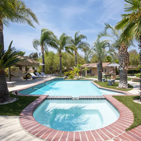 Flit between the swimming pool and spa before drying off naturally on one of the loungers