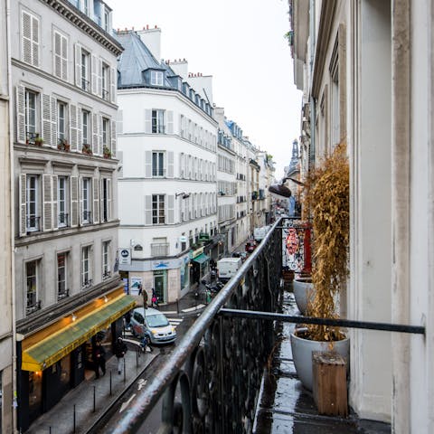 Enjoy a pre-dinner drink, with views of the neighbourhood from the private balcony