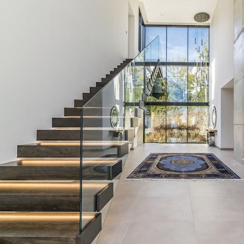 Prepare to make an entrance into the grand foyer of this designer home