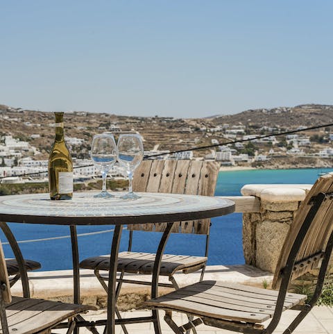 Admire the panoramic view with a bottle of local wine