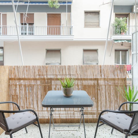 Sit on the balcony with a glass of wine