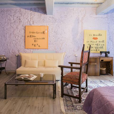 Relax on the sofa beneath the beams while enjoying your morning coffee