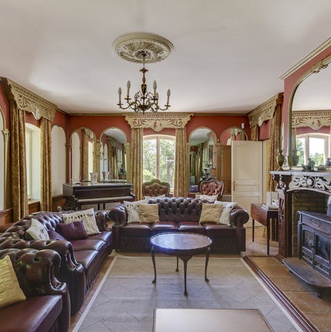 Cosy up by the fire in the drawing room