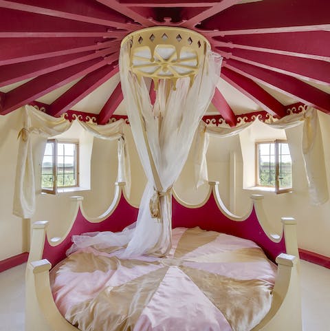 The tower boudoir's canopied circular bed