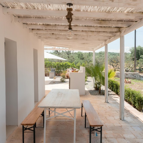 Fire up the barbecue and dine alfresco under the pergola