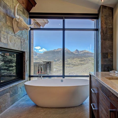 Soak in the large free-standing bathtub