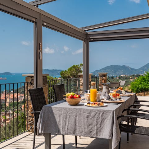 Sip an Aperol spritz on the patio and admire the fantastic sea views