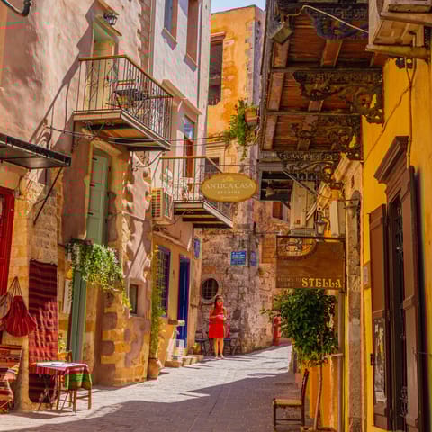 Wander through the narrow streets of Chania, a short drive along the coast