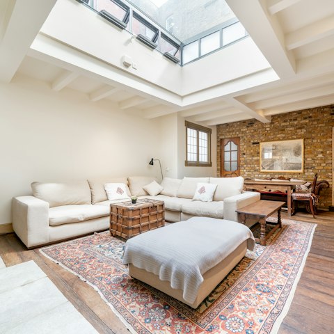 Enjoy the light flooding in through the huge skylight