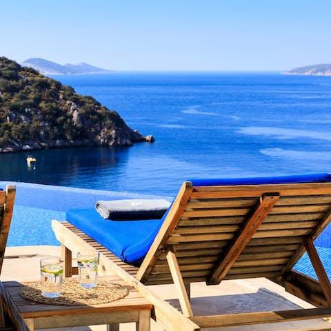 Relax with a drink by the infinity pool or cool off with a dip in the water