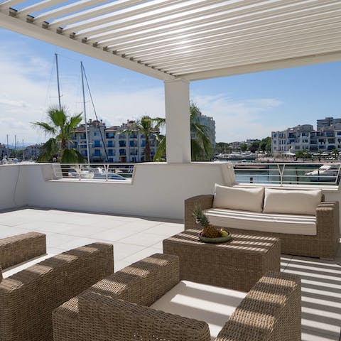 Have a few drinks on the terrace overlooking the dock