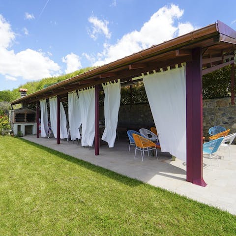 Hide away from the heat of the day in the covered barbecue terrace