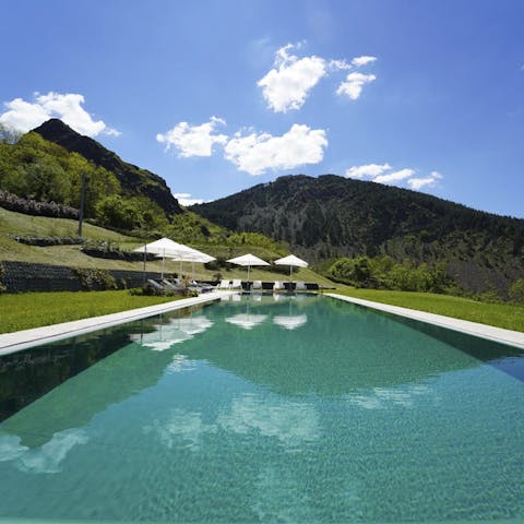 Swim laps in the long pool overlooking the Ligurian hills