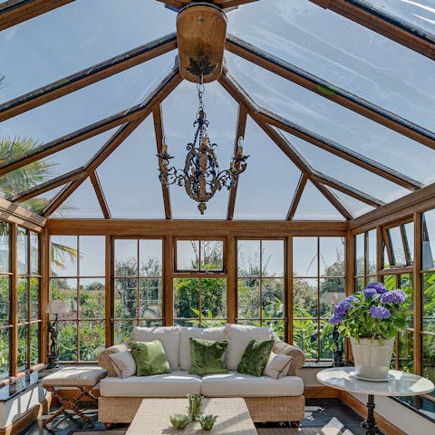 Relax in the conservatory with a good book and a plate of biscuits