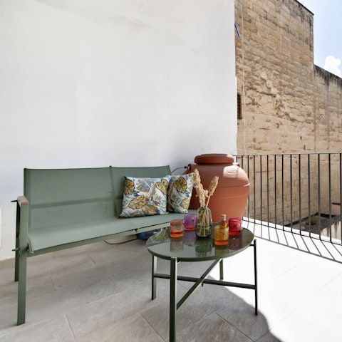 Relax with a glass of wine on the patio