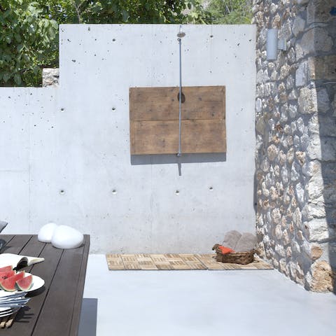 Wash of sandy feet under the outdoor shower