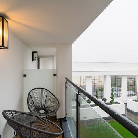 Sip your morning cup of coffee on the balcony overlooking the courtyard