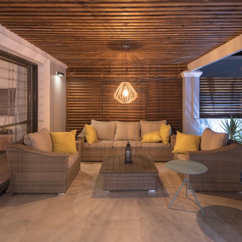 End the evening with a glass of pinotage on the cushy outdoor sofas