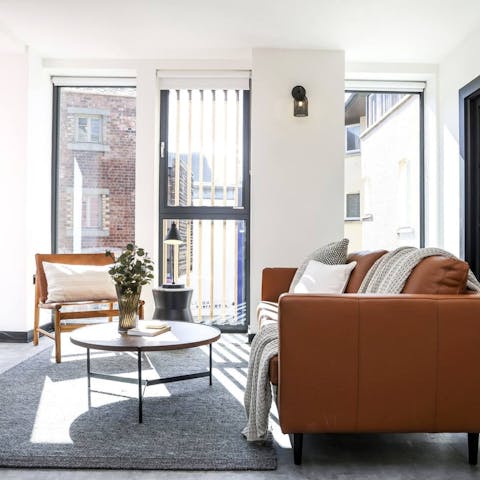 Enjoy your morning coffee by the bright, floor-to-ceiling windows in the lounge