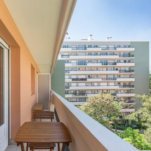 Enjoy a glass of French wine on the private balcony