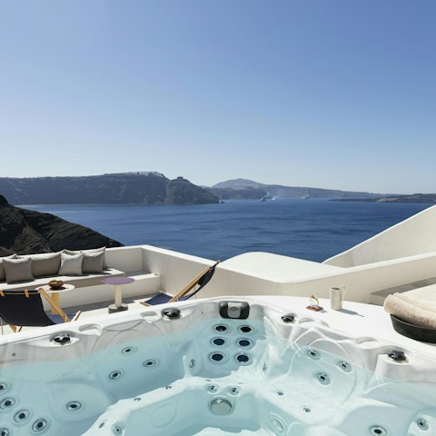 Unwind in the hot tub as the sun begins to set
