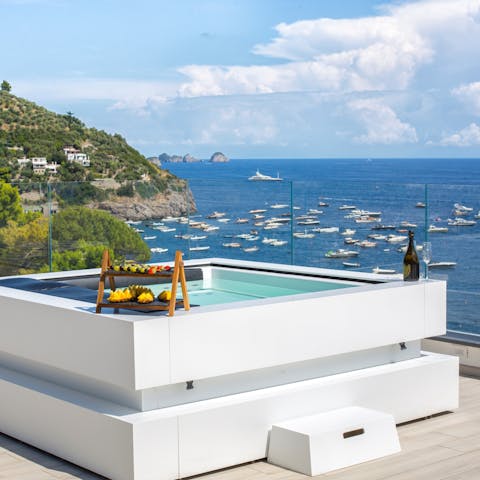 Soak up the sea views from the hot tub on the rooftop terrace