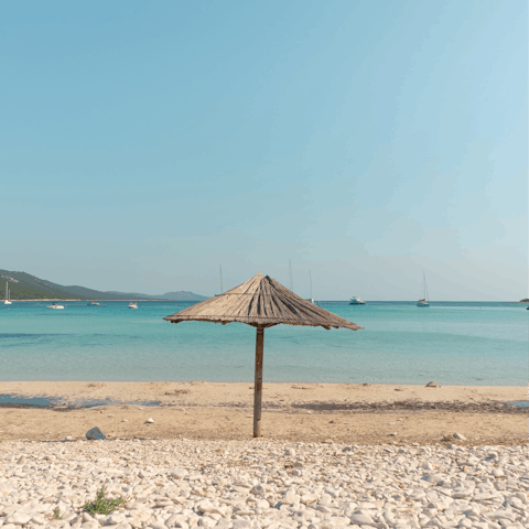 Dip in the sea at Marina del Cantone pebble beach, 300m away