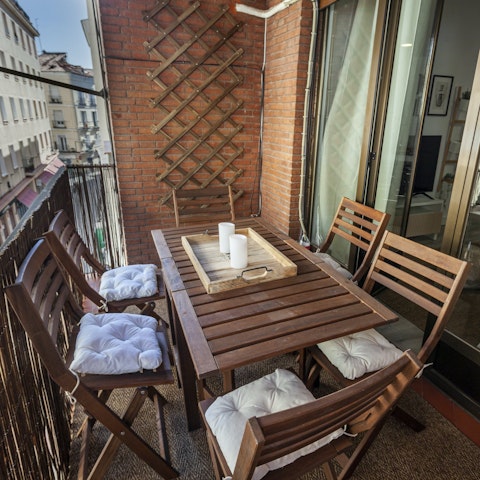 Enjoy a glass of wine on the balcony before heading into La Latina for tapas