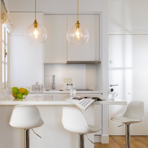 Enjoy an aperitif of tapas and Spanish wine at the kitchen bar