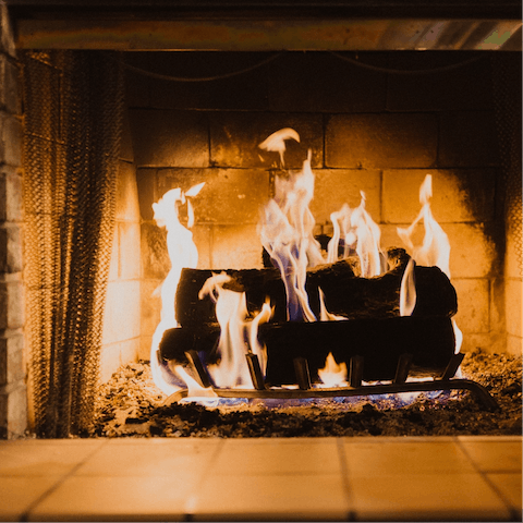 Spend cosy evenings curled up by the wood-burning fireplace