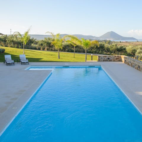 Take a dip in the pool with views across the sea and surrounding hills