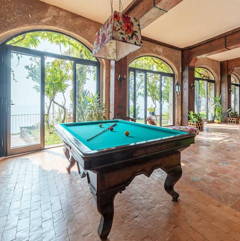 Escape from the sun to enjoy a game of pool