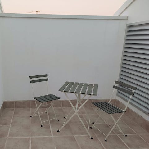 Enjoy a sundowner on the private balcony