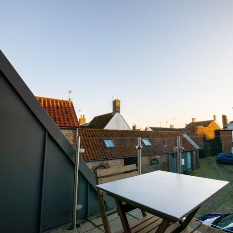 Take a tumbler of whisky out to the balcony at sunset
