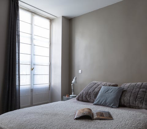 Drift off among the dusty blue tones of the master bedroom