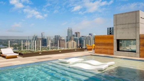 Float above the Austin skyline in the communal pool