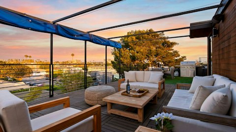 Catch the evening light across Venice from the rooftop lounge