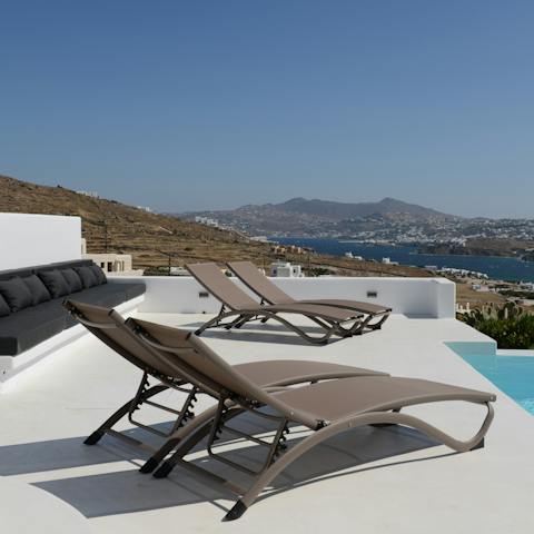 Admire the views over the blue Aegean Sea, and beyond