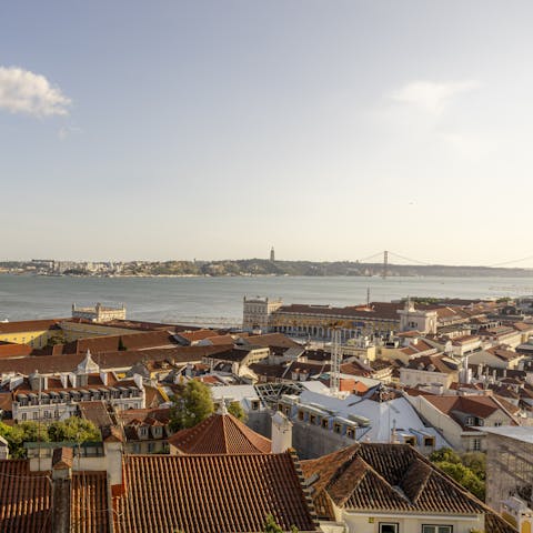 Watch the sun set over the Tagus River from the balcony