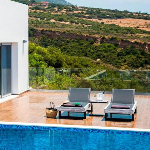 Soak up the Greek sun on plush sun loungers