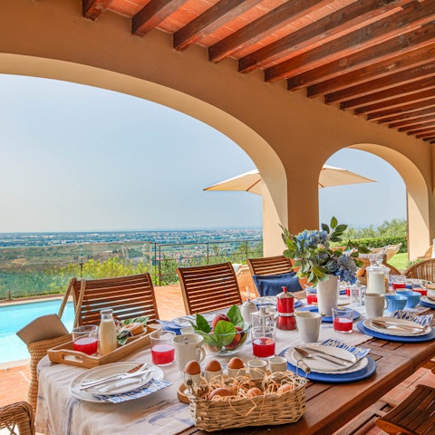 Admire the scenery on the private terrace, a glass of wine in hand