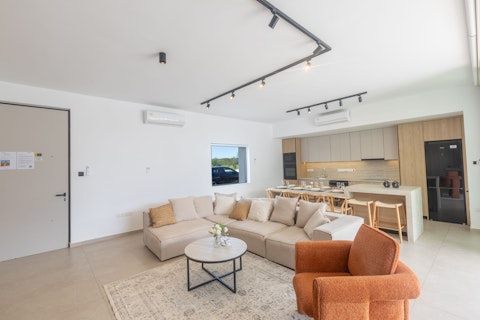Cook, dine, and unwind in one light-filled social space