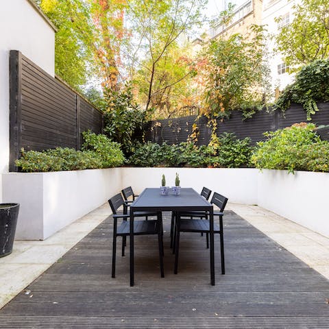 Enjoy sundowners on the leafy patio