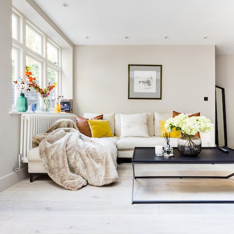 Cuddle up on the comfortable sectional with a cup of tea and a good book