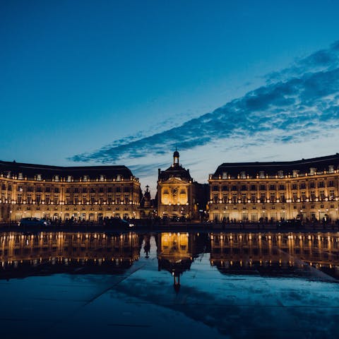Admire the Place de la Bourse, just a short walk away